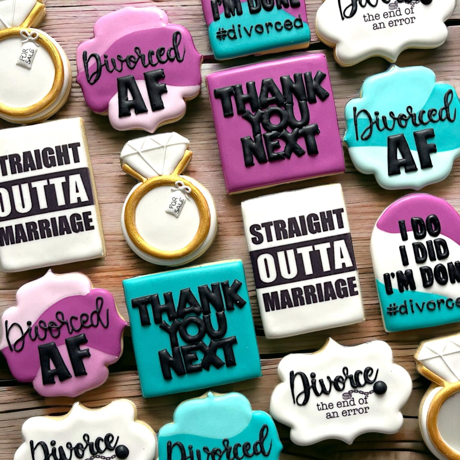 A variety of cookies celebrating divorce - in teal & fuchsia colours